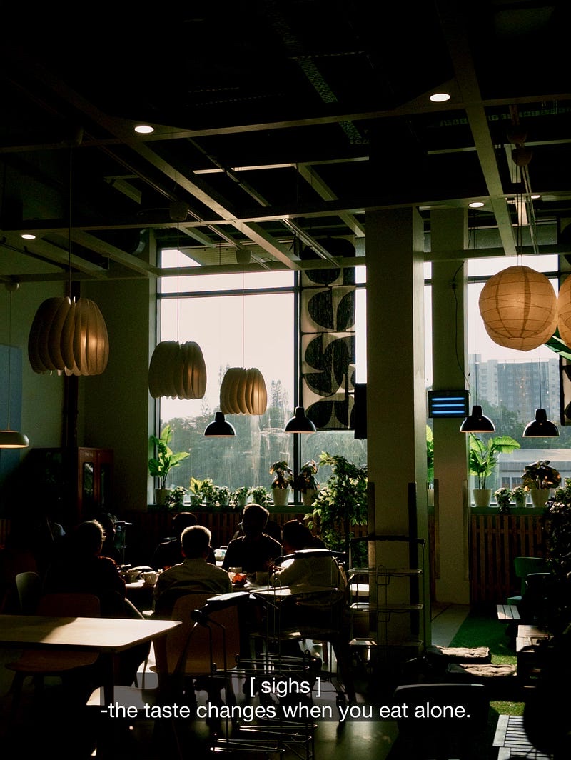A café photograph with the subtitle: the taste changes when you eat alone.